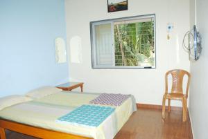 Postel nebo postele na pokoji v ubytování Hotel Anjali Lodge Malvan
