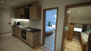 a kitchen with a sink and a counter top at Maierhof in Chieming +8 photos