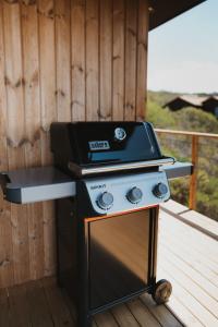 a grill sitting on top of a deck at Ocean's Edge - Private Nature Reserve in George