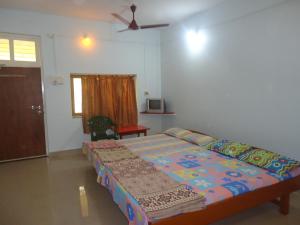 Postel nebo postele na pokoji v ubytování Hotel Anjali Lodge Malvan