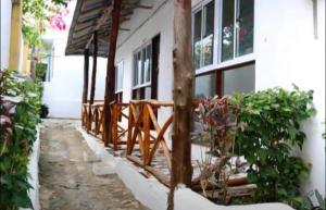 a building with a wooden fence in front of it at 27Azmaa hotel & safaris in Zanzibar City