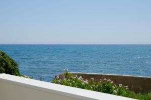 a view of the ocean from a wall at Cicirìa - Private Seafront Suites in Avola