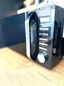 a close up of a toaster oven on a table at Wohnung in Siegen Parkplatz WLAN Autobahn in Wilnsdorf +6 photos