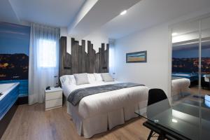 Posteľ alebo postele v izbe v ubytovaní Suite Home Sardinero