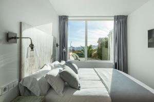 Posteľ alebo postele v izbe v ubytovaní Suite Home Sardinero