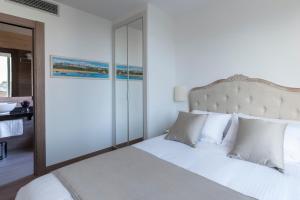 Posteľ alebo postele v izbe v ubytovaní Suite Home Sardinero