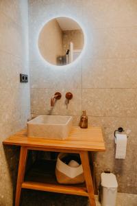 a bathroom with a sink and a mirror at sleepArt beach in Celle