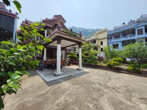 a building with a gazebo in a courtyard at Om Raghav Homestay in Kathmandu