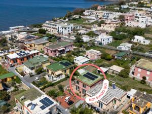 an aerial view of a city with the no boundaries sign at LES PETITES MAISONS Maison rouge in Procida