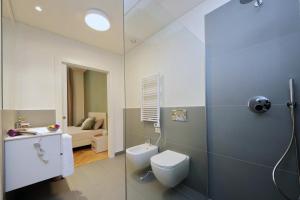 a bathroom with a toilet and a sink at CAV Juvarra in Turin +67 photos