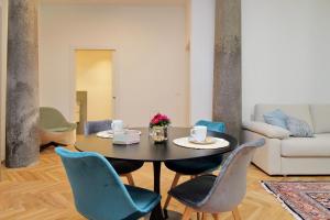 a dining room with a table and chairs at CAV Juvarra in Turin
