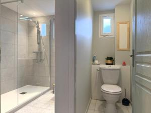 a bathroom with a toilet and a shower at Beratarbide in Laroin +19 photos