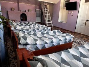 a room with a large bed in a room at Historic house in Samarkand