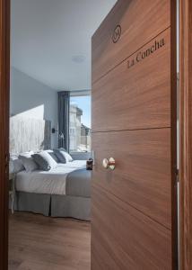 Posteľ alebo postele v izbe v ubytovaní Suite Home Sardinero
