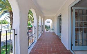a hallway of a house with a balcony at Hacienda in Cape Town