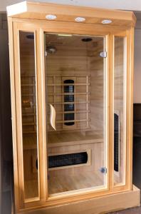 a wooden cabinet with a bird cage at 5BR - The Boulevarde Miranda - Parking in Miranda
