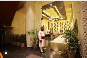 a man standing in a lobby in a building at The Grand Anukampa in Jaipur +53 photos