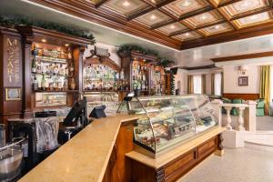 a bar with a fish tank on a counter at Festa Winter Palace Hotel in Borovets +123 photos