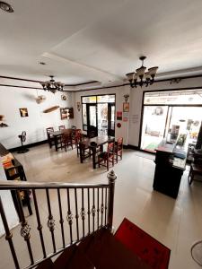a dining room with a table and some chairs at Camellia Hotel in Vang Vieng +22 photos