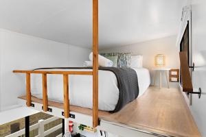 a bedroom with a bunk bed in a loft at Yellow Rock Views by Tiny Away in Broke
