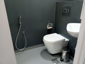 a bathroom with a toilet and a sink at Oxygen Village in Zeïda +15 photos