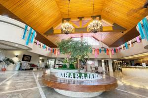 a large lobby with a sign that reads harajuana at Maharajah Hotel Angeles City in Angeles