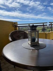 a table with a lantern on top of a balcony at Panoramic - Wanderlust #329 mit Schwimmbad in Hohegeiß