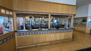 a bar with a lot of alcohol bottles at Snowdon Summit 062 in Barmouth