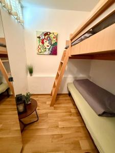 a small room with a bunk bed and a staircase at Panoramic - Wanderlust #329 mit Schwimmbad in Hohegeiß +14 photos