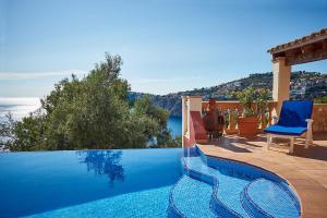 a swimming pool with a view of the ocean at Las Escaleras - Villa PEKA - 4S in Port d’Andratx