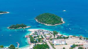 an aerial view of an island in the water at Hotel Parid in Ksamil +200 photos