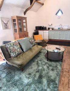 a living room with a couch and a table at Dean Linhay in Lynton