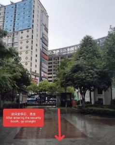 a sign in the middle of a city street at Sky Gate Guesthouse-English Speaking Hostess, Family friendly,2-minute walk to Entrance of Tianmen Mount ,Free pick up service,Book attraction tickets, Free Laundry,Private Tour in Zhangjiajie