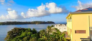 a building with a view of the water at APPARTEMENT SANS SOUCIS in Le Vauclin