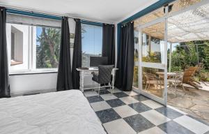 a bedroom with a bed and a desk with a computer at Casa Simba B&B in Estepona +69 photos