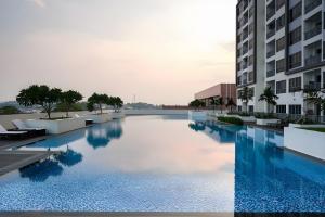 a large swimming pool in the middle of a building at LOVINA 6-11 Harbour Bay Nagoya in Nagoya