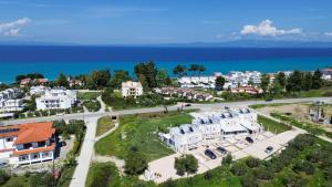 an aerial view of a city and the ocean at Aquaris in Hanioti