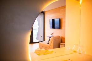 a room with a couch and a chair and a window at The Window in Bellinzona