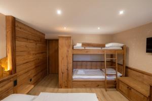 a room with two bunk beds in it at Bed & Breakfast LakeBled House in Bled