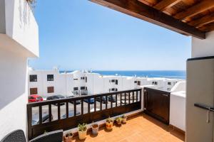 a balcony with a view of the ocean at Apartamento Alba Lanzarote in Puerto del Carmen