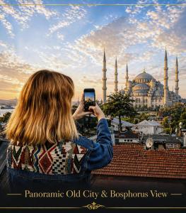 a woman taking a picture of a mosque with her cell phone at Angel's Home Suites - Angel Group Hotels in Istanbul