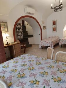 a room with a table with a table cloth on it at Il Raggio in Capri +15 photos