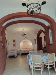 a bedroom with two beds and a table and chairs at Il Raggio in Capri