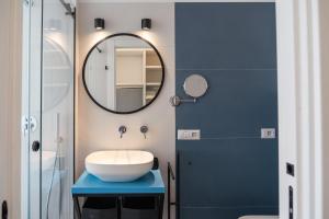 a bathroom with a sink and a mirror at La Casetta di Carol in Capri +28 photos