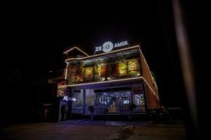 a building with a bunch of drinks on top of it at Zero Amer Royal Farm Stay in Jaipur