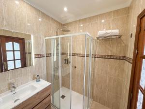 a bathroom with a shower and a sink at Sea Breeze Arguineguin in Mogán +30 photos