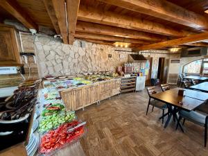 a kitchen with a counter with vegetables and a table at Cappadocia Caves Hotel in Göreme