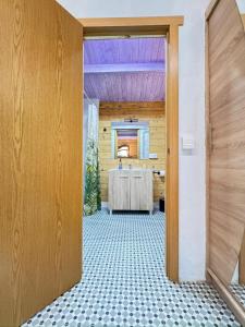 an open door to a room with a table at Can Cospito in Osor