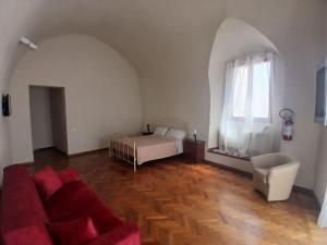 a living room with a bed and a couch at Tursi Relais Virtus in Tursi +16 photos