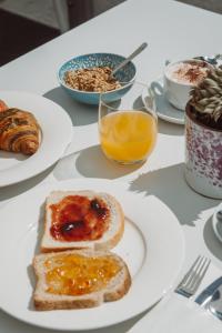 a table with plates of breakfast food on it at Pizzomunno Vieste Palace Hotel in Vieste
